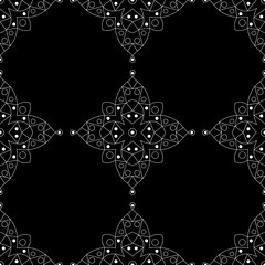 White geometric pattern on black. Seamless background. Indian style