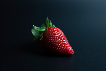 Isolated strawberry on black background