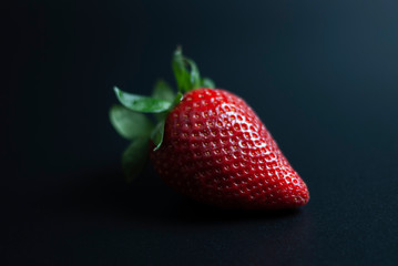 Isolated strawberry on black background