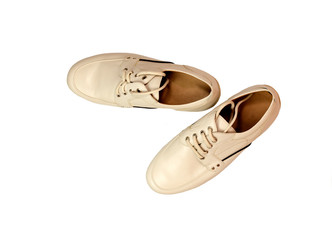 A pair of men's shoes on a white background close-up