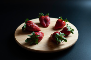 Strawberries on round wood tray