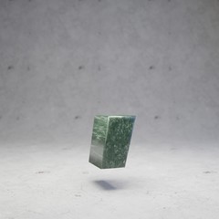 Green marble coma symbol on concrete background