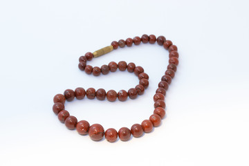 Brown jasper beads isolated on white background