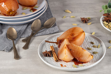 Poached pears delicious home made recipe over light kitchen countertop