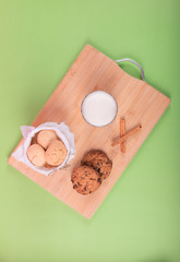 Cup of milk with cinnamon biscuits