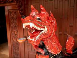 Closeup image of traditional wooden dragon sculpture i nthe asian house