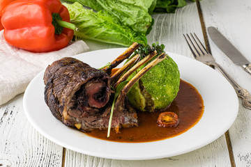 Steak with grilled vegetables in a frying pan, selective focus