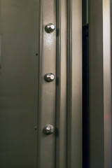 Locking mechanism of solid vault door in a bank.