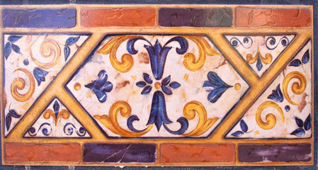 Detail of the traditional tiles from facade of old house. Decorative tiles.Valencian traditional tiles. Floral ornament.
