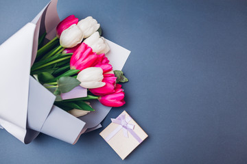 Spring flowers with gift box. Women's day background. Bouquet of white and ping tulips. Present for...