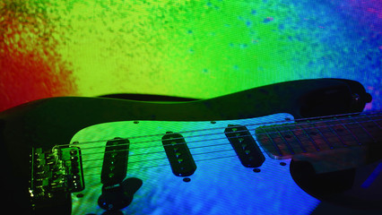 electric guitar in the stage color light . closeup