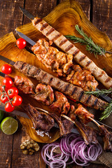 Fresh, homemade beef kebab with vegetables and spices, with barbecue sauce and ketchup