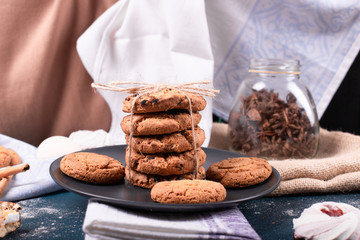 Plate of sweeties and two cakes and biscuits with cinnamon