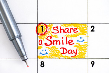 Reminder Share a Smile Day in calendar with red pen