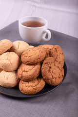 Cup of black tea with sweeties