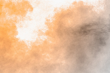 Brown dust explosion cloud.Brown particles splatter on white background.