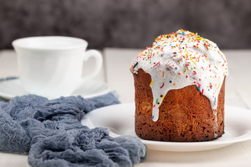 Easter cake with a cup of tea in the background