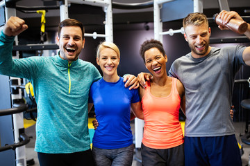 Group of friends smiling and enjoy sport in gym