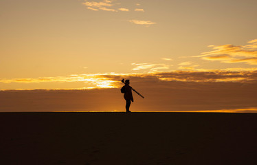 silhouette of photographer at sunset