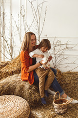 Children at Easter with rabbits and ducks