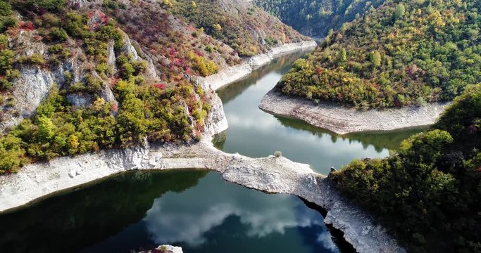 Aerial dolly out revealing Uvac river flowing through a canyon in a zigzag manner