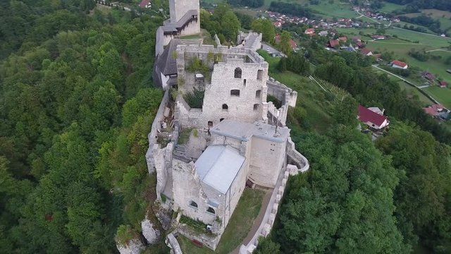 Aerial drone footage circling over castle ruins on the top of a mountain in celje slovenia