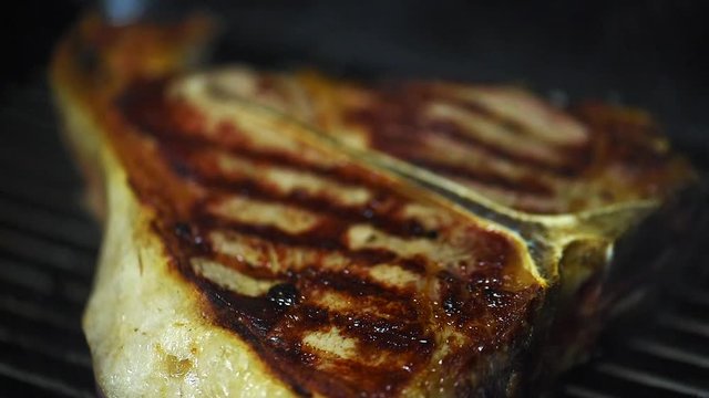 Close up shot, detailed delicious roast steak grilling