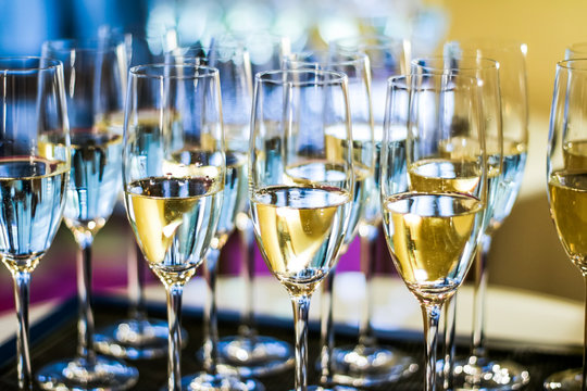 Glasses of champagne and sparkling wine served on a tray during charity event