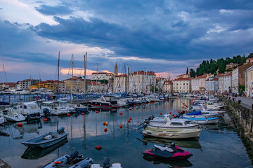 Fototapeta na wymiar Comfortable boats and yachts in harbour of Piran, Slovenia.