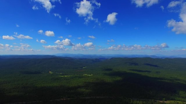 Action shot of a drone flying of the Mogollon Rim near Payson, AZ. ACTION SHOT. Drone flying of a cliff in the woods