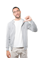 Serious young man doing a gesture of defeated
