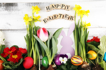 Happy Easter wooden letter. Holiday concept design. Happy Easter flat lay with flower and egg