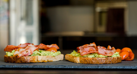 avocado toast with cherries tomatoes and bacon
