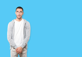 Fototapeta premium Serious young man looking against background