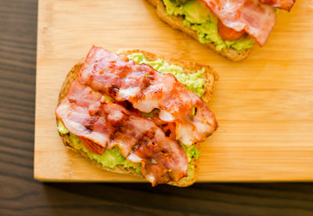 avocado toast with cherries tomatoes and bacon