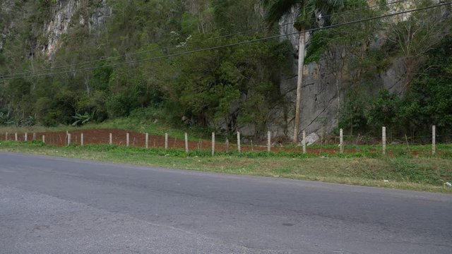 old light blue american car passing Palenque