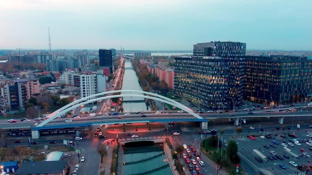Bucharest aerial view, Grozavesti office buildings at sunset with bridge and traffic , Romania