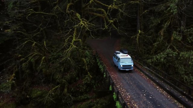 Aerial pan of aVan on a bridge in the Pacific Northwest