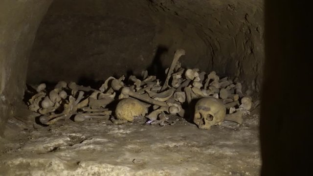 Human bones and skull in a tomb.