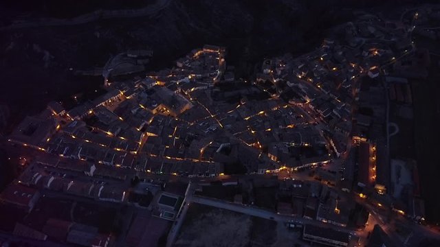 Fantastic aerial TIME-LAPSE of a MAGICAL rural town as night falls and cars pass along the roads, forming a cozy light show. (Rubielos de Mora - Spain - Ferrero Rocher) (1300 ft! )