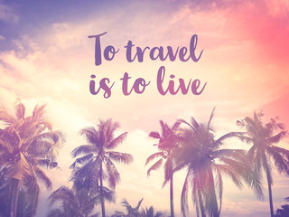 To travel is to live word on palm tree pink pastel sky background