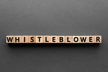 Whistleblower - words from wooden blocks with letters, disclosing information whistleblower...
