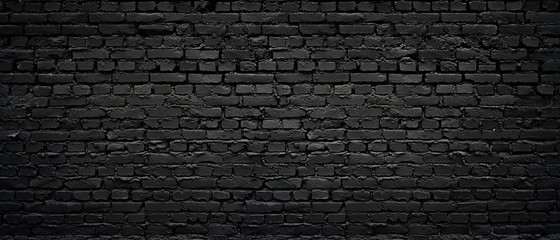 Perfect black brick wall as background or wallpaper or texture