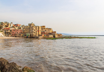 Obraz premium Beirut, Lebanon - once a popular bathing spot, the Saint Simon beach today is a pretty messy district with rundown buildings and trash all over. Still it can dispay beautiful views