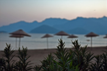 Fototapeta na wymiar beach with chairs and umbrellas. aegean. Turkey