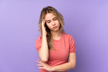 Teenager Russian girl isolated on purple background with headache