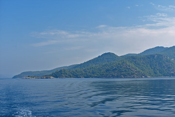 blue water, blue sky, mountains. aegean. Turkey