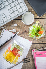 Healthy take-away Office lunch. Vegan vegetable salad in glass jars, with sliced fresh vegetables. Detox, raw eating and zero waste lunch concept.