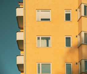 Fototapeta na wymiar Yellow modern building on a clear day at sunset