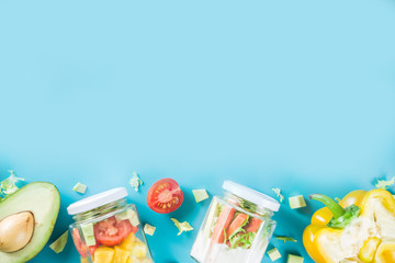 Healthy take-away lunch jar. Vegan vegetable salad in glass jars, with sliced fresh vegetables. Detox, raw eating and zero waste lunch concept